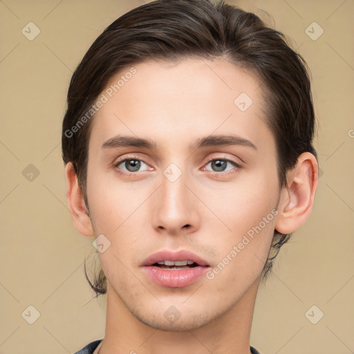 Joyful white young-adult male with medium  brown hair and brown eyes