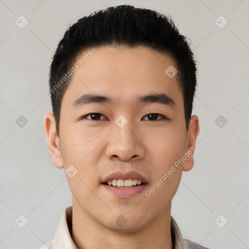 Joyful asian young-adult male with short  black hair and brown eyes