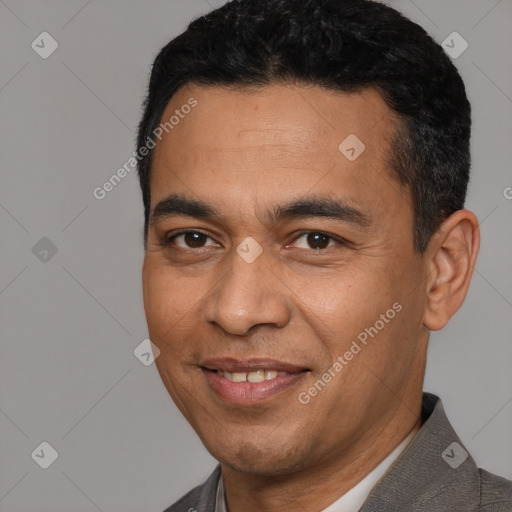 Joyful white young-adult male with short  black hair and brown eyes