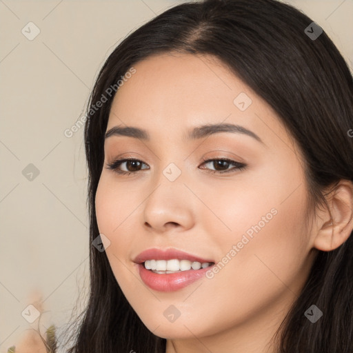 Joyful white young-adult female with long  black hair and brown eyes