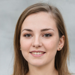 Joyful white young-adult female with long  brown hair and green eyes