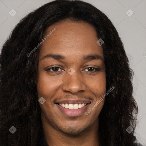 Joyful black young-adult female with long  brown hair and brown eyes