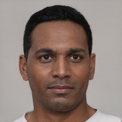 Neutral black young-adult male with short  black hair and brown eyes