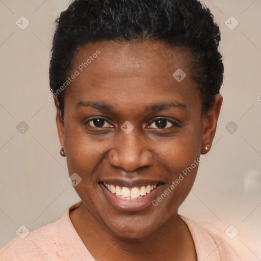 Joyful black young-adult female with short  brown hair and brown eyes