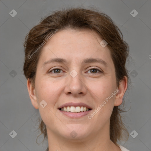 Joyful white adult female with medium  brown hair and grey eyes