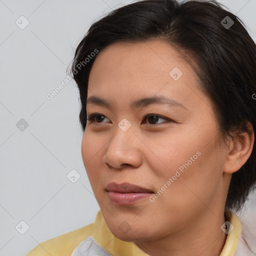 Joyful asian young-adult female with short  brown hair and brown eyes