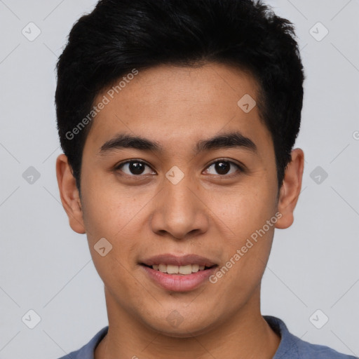 Joyful latino young-adult male with short  black hair and brown eyes