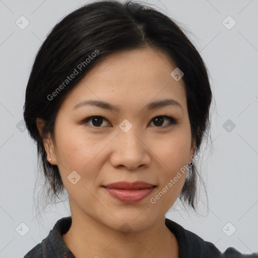 Joyful asian young-adult female with medium  black hair and brown eyes