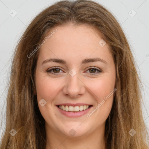 Joyful white young-adult female with long  brown hair and green eyes