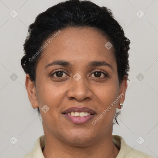 Joyful black adult female with short  brown hair and brown eyes