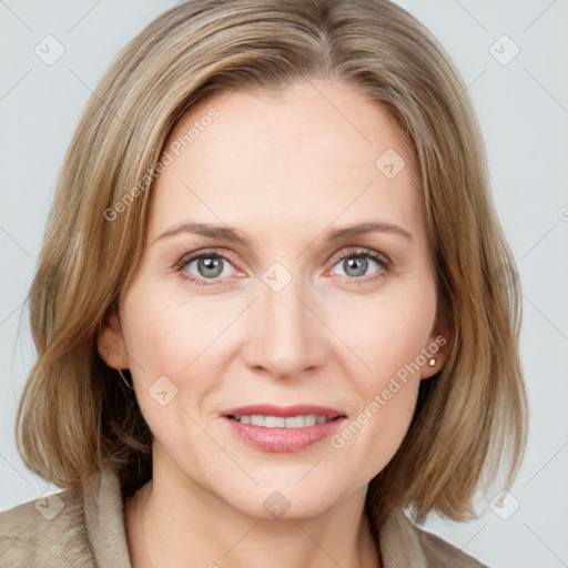 Joyful white young-adult female with medium  brown hair and blue eyes