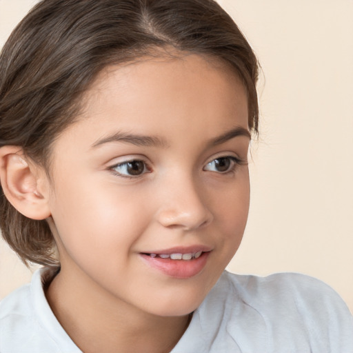 Joyful white child female with medium  brown hair and brown eyes