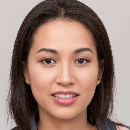 Joyful white young-adult female with long  brown hair and brown eyes