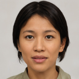 Joyful asian young-adult female with medium  brown hair and brown eyes