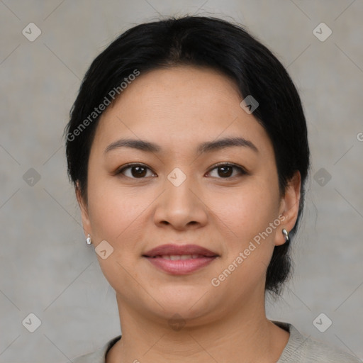 Joyful asian young-adult female with medium  black hair and brown eyes