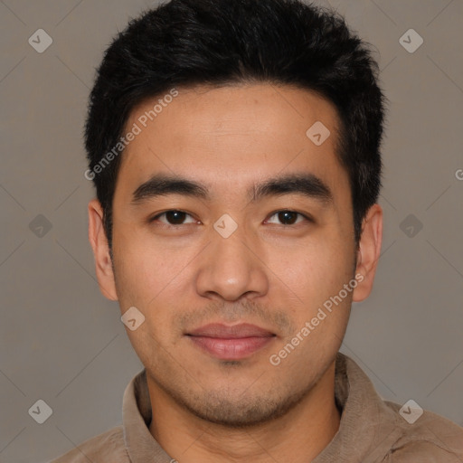 Joyful asian young-adult male with short  black hair and brown eyes