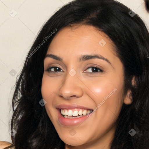 Joyful latino young-adult female with long  black hair and brown eyes