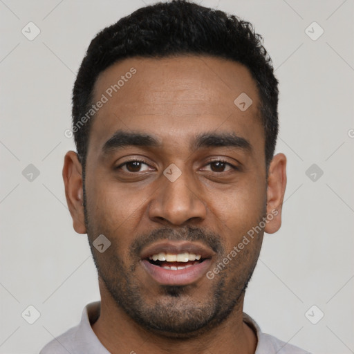 Joyful black young-adult male with short  black hair and brown eyes