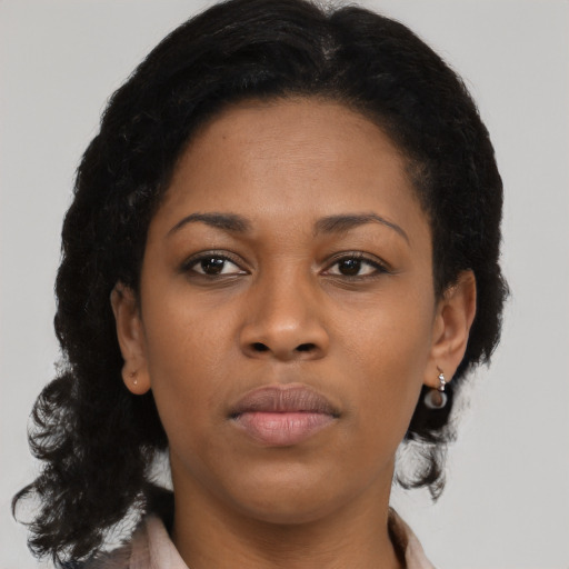 Neutral black young-adult female with long  brown hair and brown eyes