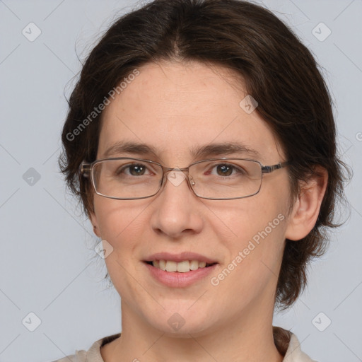 Joyful white adult female with medium  brown hair and brown eyes