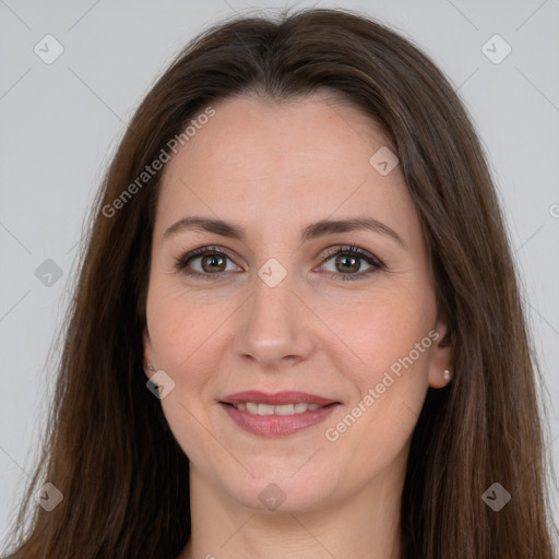 Joyful white adult female with long  brown hair and brown eyes