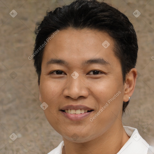 Joyful asian young-adult male with short  black hair and brown eyes