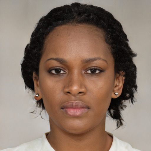 Neutral black young-adult female with medium  black hair and brown eyes