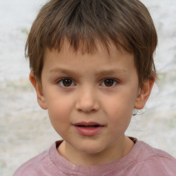 Joyful white child male with short  brown hair and brown eyes