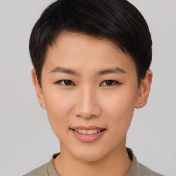 Joyful asian young-adult female with short  brown hair and brown eyes