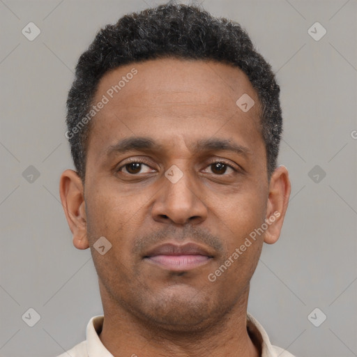 Neutral latino young-adult male with short  brown hair and brown eyes