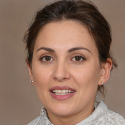 Joyful white adult female with medium  brown hair and brown eyes