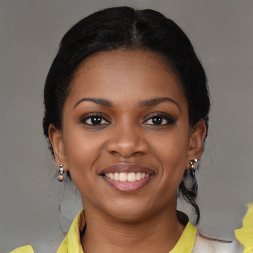 Joyful latino young-adult female with medium  black hair and brown eyes