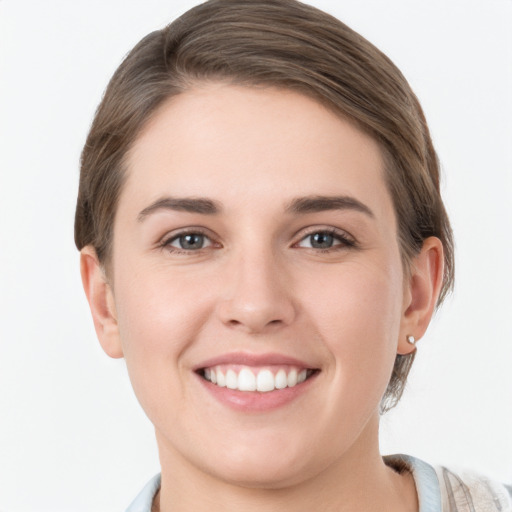 Joyful white young-adult female with short  brown hair and grey eyes