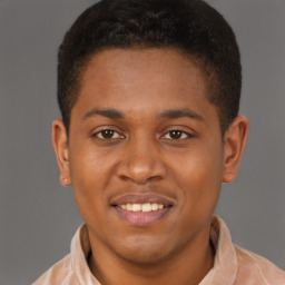 Joyful latino young-adult male with short  brown hair and brown eyes