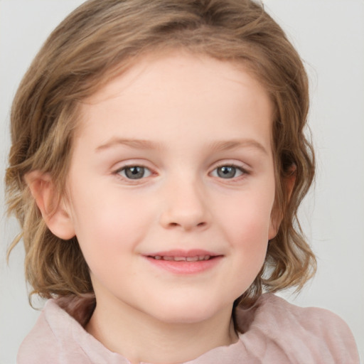 Joyful white child female with medium  brown hair and blue eyes