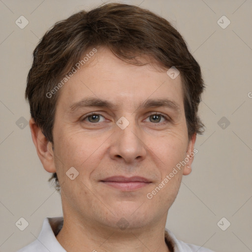 Joyful white adult male with short  brown hair and brown eyes