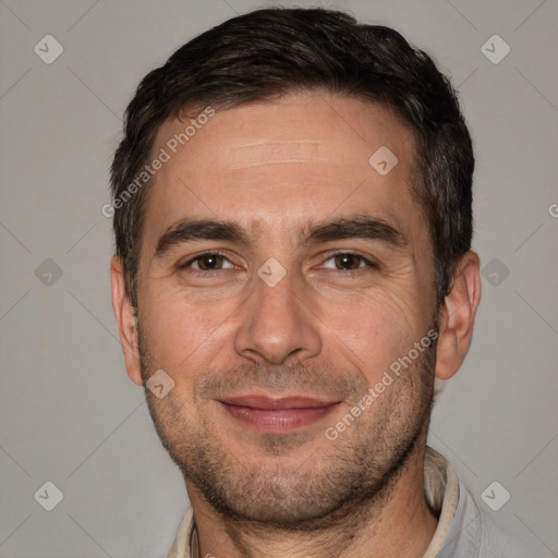 Joyful white adult male with short  brown hair and brown eyes