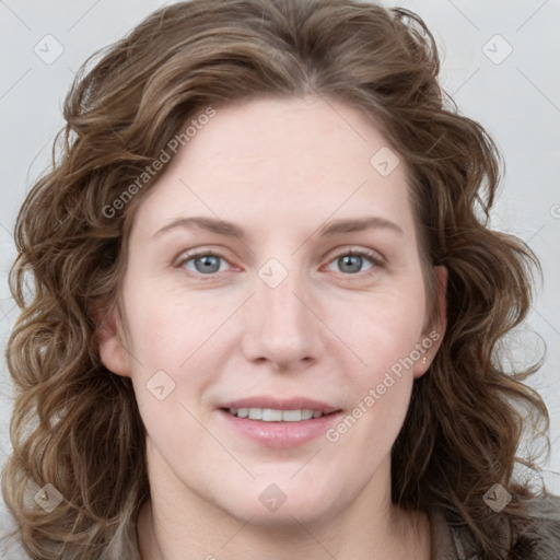 Joyful white young-adult female with long  brown hair and blue eyes