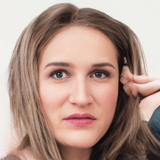 Joyful white young-adult female with long  brown hair and grey eyes