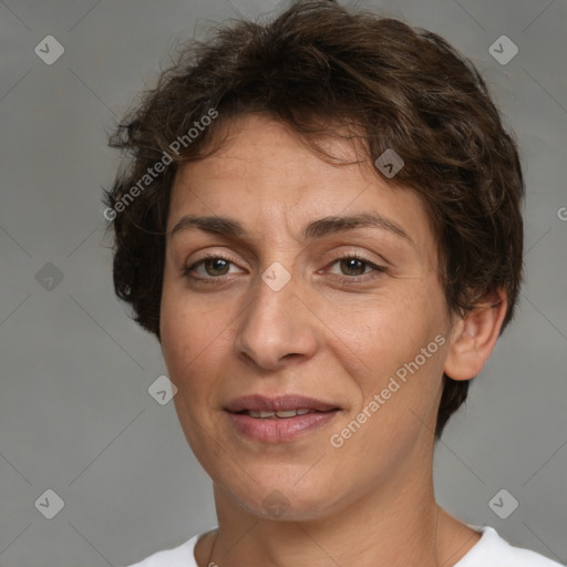 Joyful white adult female with short  brown hair and brown eyes