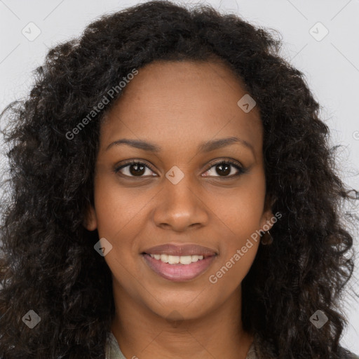 Joyful black young-adult female with long  brown hair and brown eyes