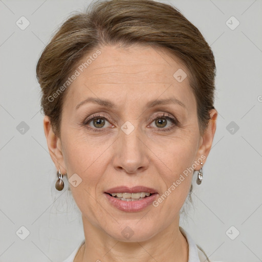 Joyful white adult female with short  brown hair and grey eyes