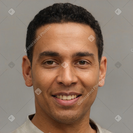 Joyful latino young-adult male with short  black hair and brown eyes