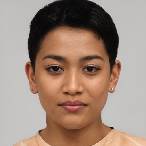 Joyful asian young-adult female with short  black hair and brown eyes