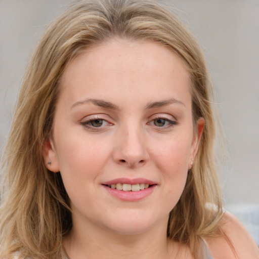 Joyful white young-adult female with medium  brown hair and blue eyes