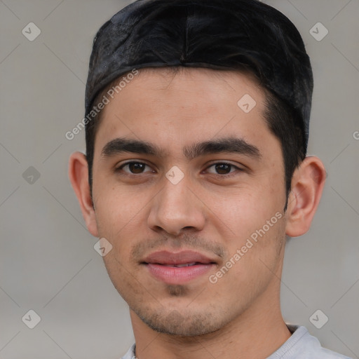 Joyful white young-adult male with short  black hair and brown eyes