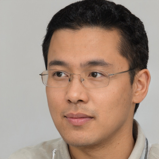 Neutral asian young-adult male with short  black hair and brown eyes