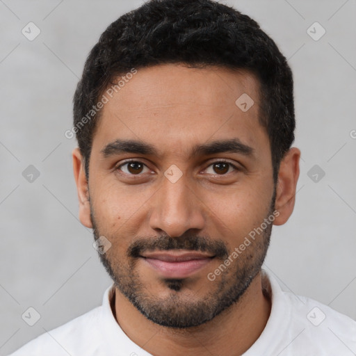 Joyful latino young-adult male with short  black hair and brown eyes