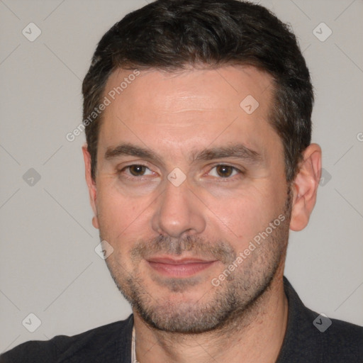 Joyful white adult male with short  brown hair and brown eyes