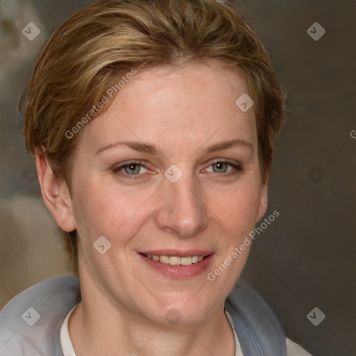 Joyful white adult female with short  brown hair and grey eyes